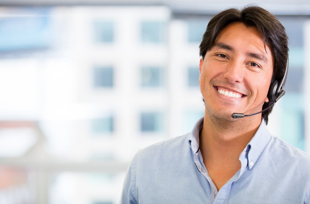 Customer service representative wearing a headset at the office